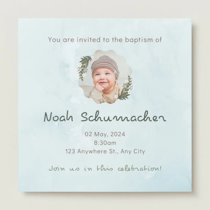 Photorealistic church interior, golden sunlight through stained glass. Centered square invitation on light blue watercolor paper. Scalloped frame with baby portrait, olive branch wreaths, and elegant typography. Soft atmospheric lighting, warm tones.